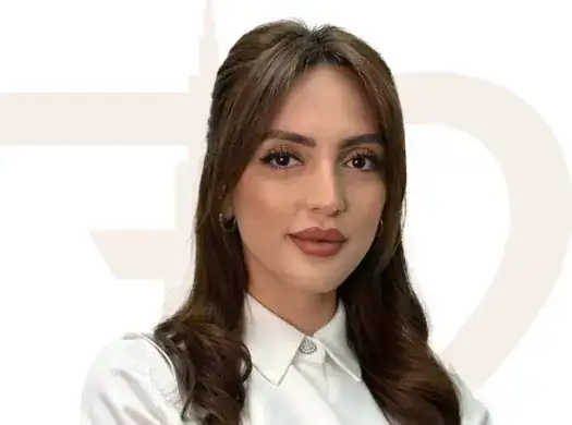 Elegant real estate agent portrait representing SEVENTY TWO REAL ESTATE services, showcasing professionalism and expertise in property sales and rentals.