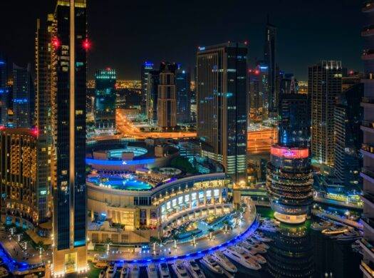 a night view of a city with a lot of tall buildings